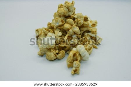 Popcorn isolated on white background, closeup of a pile of popcorn