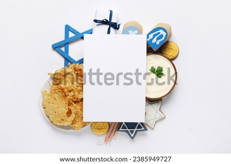 Blank greeting card with different Hannukah symbols on white background