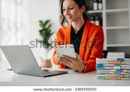Close up of businesswoman or accountant hand typing laptop working to calculate on desk about cost at home office.
 Royalty-Free Stock Photo #2385950593