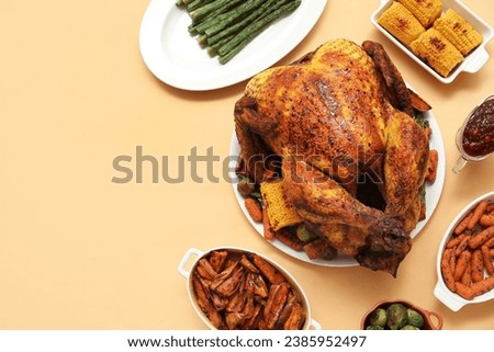 Plate with tasty roasted turkey and different dishes for Thanksgiving day on beige background