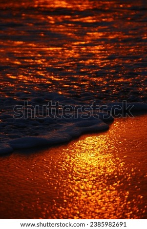 Sea foam reflecting the sunset in Indonesia 