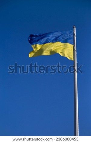Flag of ukraine against the blue sky close-up. National pride and symbol of the country Ukraine. War in Ukraine. Yellow-blue flag.