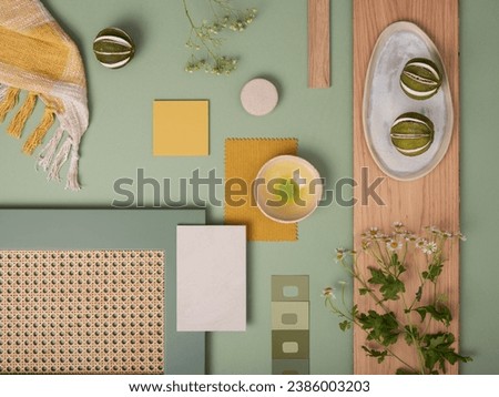 Elegant  flat lay composition in green and yellow color palette with textile and paint samples, lamella panels and tiles. Architect and interior designer moodboard. Top view. Copy space.