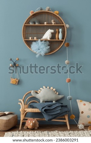 Child room interior with blue wall, round shelf on wall, wooden armchair, plaid, colorful garland, sculpture, plush toys, wooden camera, braided rug and personal accessories. Home decor. Template.