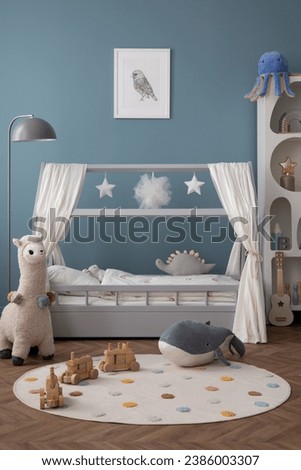 Creative composition of child room interior with mock up poster frame, cozy bed, stylish rack, blue wall, rack with toys, plush lama, gray lamp, guitar and personal accessories. Home decor. Template.