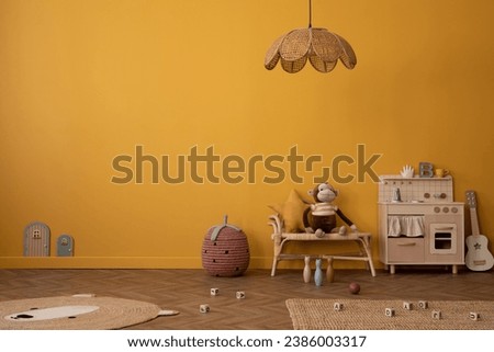 Warm and cozy composition of child room interior with copy space, children kitchen, braided bench, basket, guitar, bear carpet, wooden blocks and personal accessories. Home decor. Template.