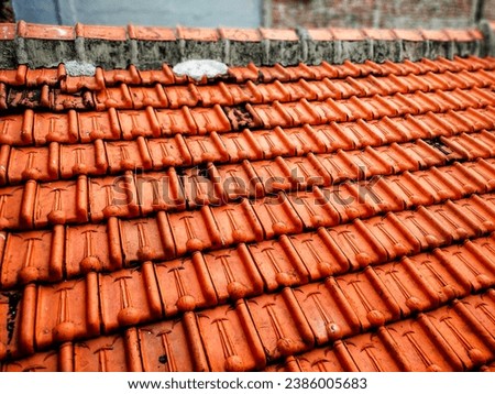 reddish orange clay roof tiles on the roof of a building