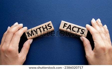 Facts or Myths symbol. Concept word Facts or Myths on wooden blocks. Businessman hand. Beautiful deep blue background. Business and Facts or Myths concept. Copy space Royalty-Free Stock Photo #2386020717