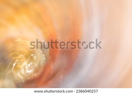 abstract blurred beige, golden, orange, yellow, blue and white festive background