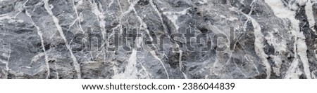 4x1 banner for social networks, website or printing house. The background from the picture of a natural stone of dark blue color with white veins