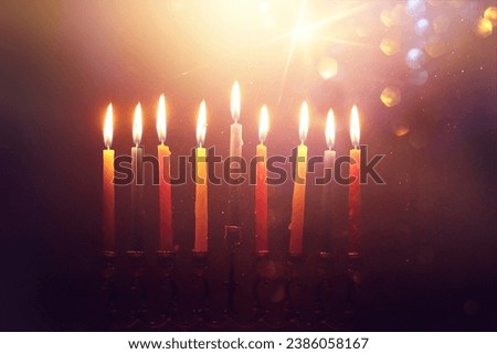 Religion image of jewish holiday Hanukkah background with menorah (traditional candelabra) and candles Royalty-Free Stock Photo #2386058167