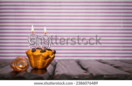Birthday number 93. Date of birth with number of candles, copy space. Anniversary background with cake or muffin with burning candles. Greeting card. Royalty-Free Stock Photo #2386076489