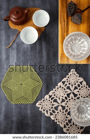 Various antique objects on black chalkboard background. Flat lay. Top view. Copy space.