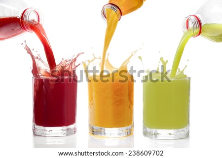 Fruit juices poured from bottles Kiwi, currants, orange Royalty-Free Stock Photo #238609702