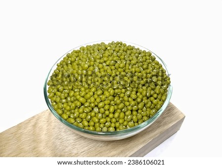 green beans or green gram (Vigna Radiata) on wood with a white background, green beans are a source of quality protein