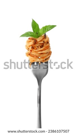 Fork with tasty pasta and basil isolated on white Royalty-Free Stock Photo #2386107507