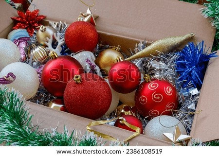 Christmas tree decorations in cartoon box