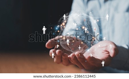 Business man point to people with many business person or working staff. Target customer or Human resource, head hunter concept. Global business target that can reach many people. Royalty-Free Stock Photo #2386112445