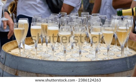 Tasting of sparkling white wine with bubbles champagne on summer weekend festival route of champagne in Cote des Bar, Champagne region, France Royalty-Free Stock Photo #2386124263