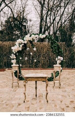 Floral decoration of tables and chairs. Interior and exterior decoration. Wedding decoration.

