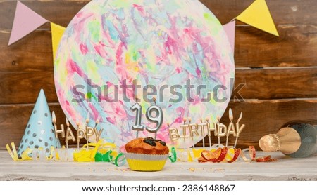 Date of Birth  19. Happy birthday candles. Pie with burning candles. Congratulation postcard. Anniversary. Festive muffin with decorations. Copy space.
