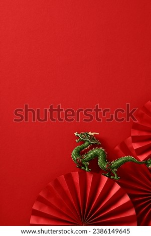 2024 Chinese New Year poster with folding paper fans, dragon on red background. Asian celebration art, symbolic composition