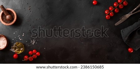 Food background, spices, tomatoes and oil on a black background, web banner with free space for text. High quality photo