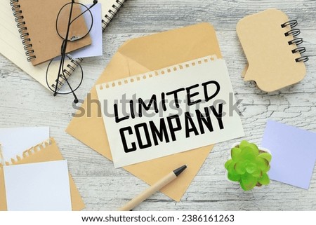 glasses on the envelope. paper with text on the envelope. purple note paper. Limited Company