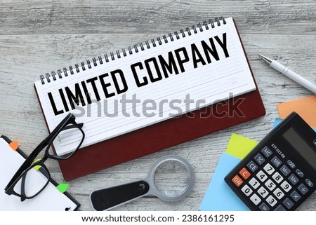 LLC (Limited Liability Company) text on the open diary page. near bright stickers Royalty-Free Stock Photo #2386161295