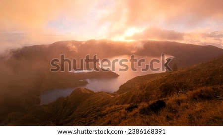 Sunrise at Miradouro da Pico da Barrosa overlooking Lake Lagoa do Fogo on the Portuguese island of São Miguel in the Azores