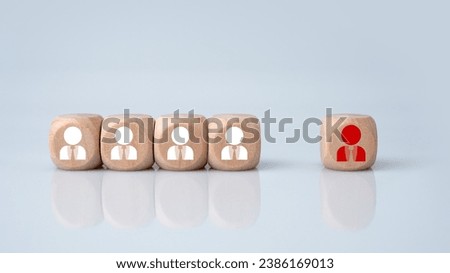 The HRM concept represents leadership and team leadership. One wooden block is different and stands out from the group.