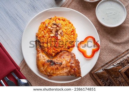 Mandi rice dish with grilled chicken