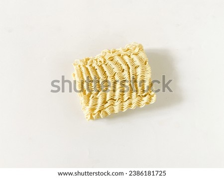 Dry instant noodles isolated on a white background. Ramen noodles top view