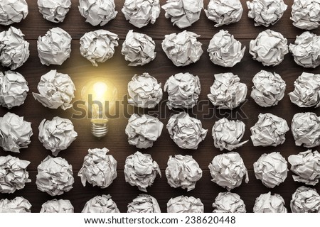 new idea concept with crumpled office paper and light bulb Royalty-Free Stock Photo #238620448