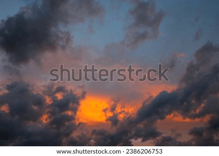 Nice sunset on the sky with clouds