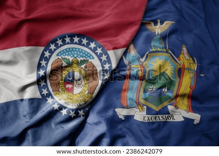 big waving colorful national flag of new york state and flag of missouri state . macro