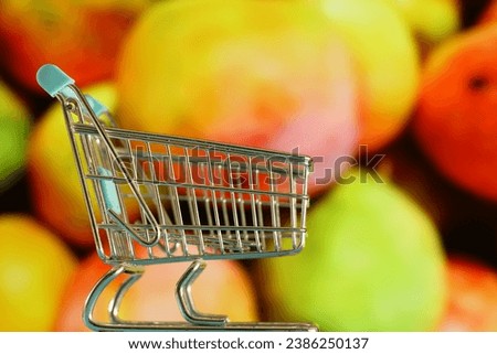 Supermarket shopping cart with commercial background as a consumer concept.