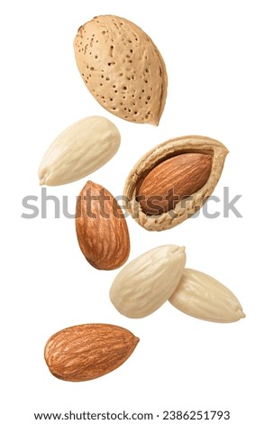 Flying almond in shell isolated on white background. Blanched nuts. Package design element with clipping path Royalty-Free Stock Photo #2386251793