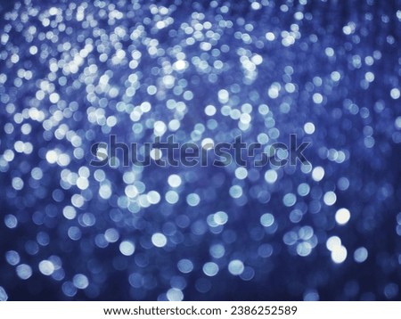 Out of Focus, Defocused, Blurred, Abstract and Bokeh of Sparkling Blue Lights, Suitable for Background Use