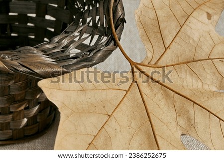 top view autumn leaf in a wicker basket 