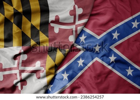 big waving colorful confederate jack flag and flag of maryland state . macro