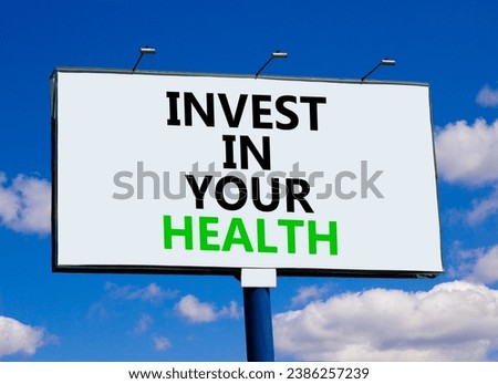 Invest in your health symbol. Concept word Invest in your health on beautiful big white billboard. Beautiful blue sky cloud background. Invest in your health concept. Copy space.