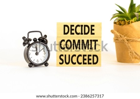Decide commit succeed symbol. Concept word Decide Commit Succeed on beautiful wooden block. Black alarm clock. Beautiful white table background. Business decide commit succeed concept. Copy space.