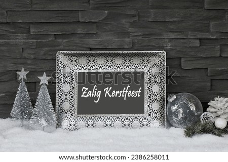 Christmas card: Elegant Christmas decoration with Christmas baubles in the snow. Dutch
Text translates as Merry Christmas and a Happy New Year
