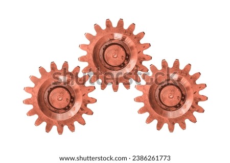 Three copper gears are isolated white background. Cogwheels.
