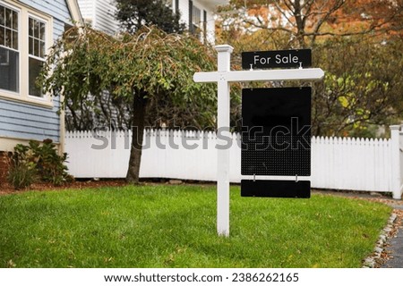 'For Sale' sign against a blue sky, symbolizing real estate opportunities with space for your dreams