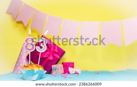 Date of birth with cake and number  83. Colorful card happy birthday for a girl. Copy space. Anniversary card pink. Congratulations on the decorations are beautiful.