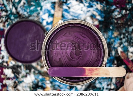Paint Can Open Unmixed Close Up Purple Mixing Stick Top Paint Mess Background Royalty-Free Stock Photo #2386289611