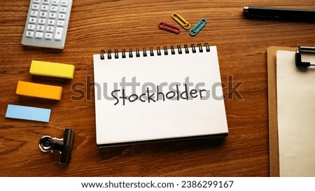 There is notebook with the word Stockholder. It is as an eye-catching image.
