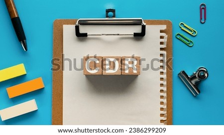 There is wood cube with the word CDR. It is an abbreviation for Carbon Dioxide Removal as eye-catching image. Royalty-Free Stock Photo #2386299209